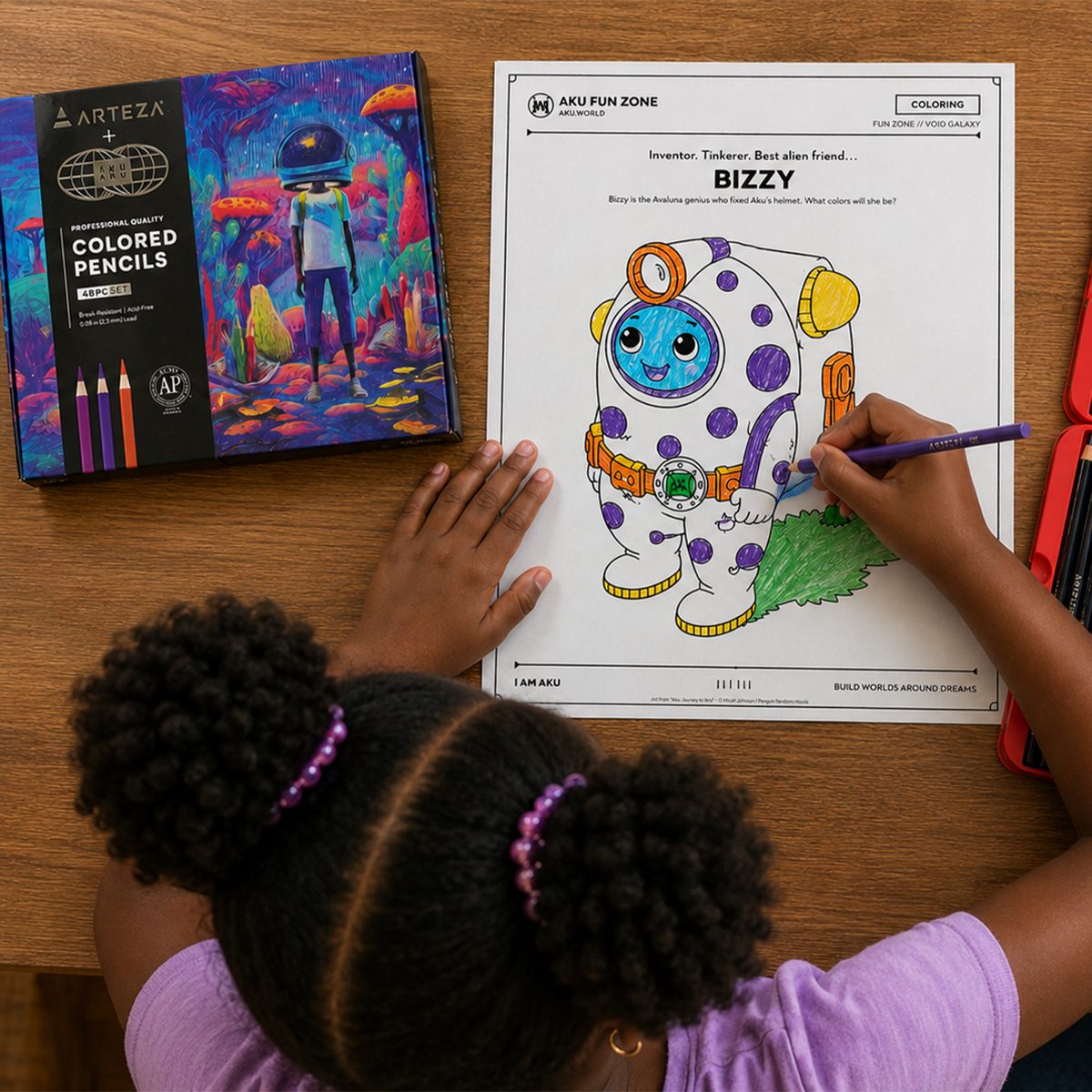 A child coloring an Aku Fun Zone activity sheet with colored pencils