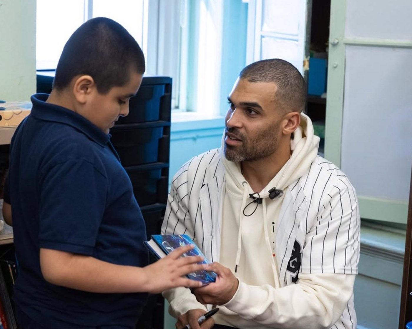 Micah Johnson with students and the Chicago White Sox